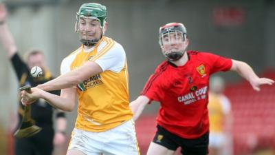 Antrim's Paul Shiels is challenged by Down's Ryan Brannigan at the recent 2013 Ulster Hurling Final at Celtic Park