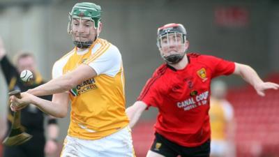 Antrim's Paul Shiels is challenged by Down's Ryan Brannigan at the recent 2013 Ulster Hurling Final at Celtic Park