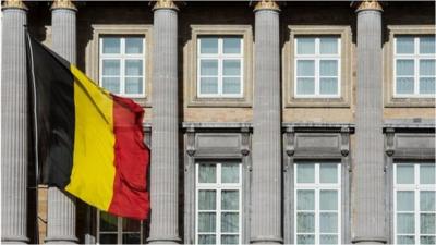 Belgium's national flag flies outside the parliament building in Brussels. Photo: 12 February 2014