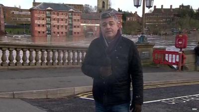 BBC reporter Phil Mackie by the River Severn in Worcester