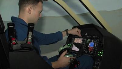 man in helicopter simulator