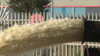 Flood water pumped out of pipe