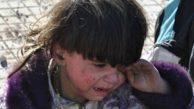 A Syrian child cries in the city of Homs. Photo: 12 February 2014