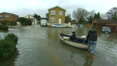 A boat on a flooded street