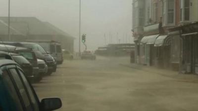 Sand blowing in street at Aberdovey, Gwynedd