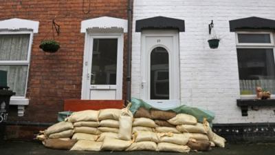 House protected by sandbags