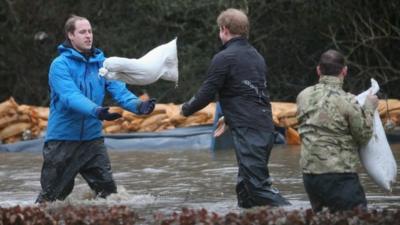 Prince William and Harry shift sandbags