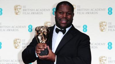 Steve McQueen celebrates winning the Best Film Bafta for the film 12 Years A Slave