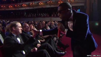 Tinie Tempah high-fives Prince William