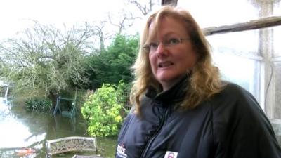 Egham resident Angela Cooper and her flooded garden