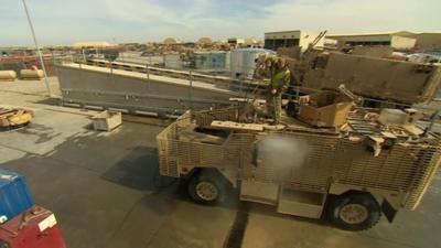 Cleaning a truck in Afghanistan