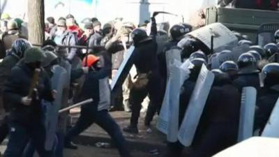 Protesters and riot police square off