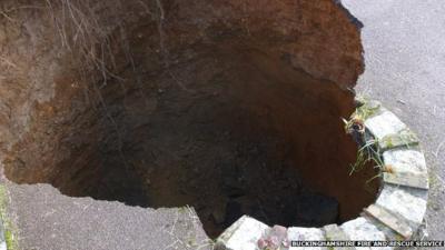 A 30ft deep sinkhole which opened up in the driveway of a house in High Wycombe