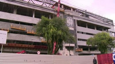 The unfinished exterior of the stadium