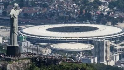 Aerial view of the Christ the Redeemer statue atop Corcovado Hill and the Mario Filho (Maracana) stadium in Rio de Janeiro, Brazil