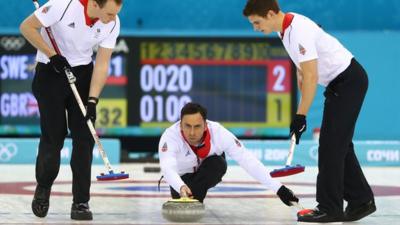 Wales coach Adrian Meikle talks Ayshah through the tools of the curling trade