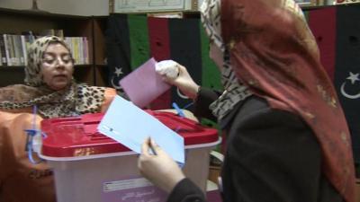 A woman voting in Libya