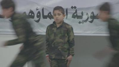 Young Syrian boys in army uniform