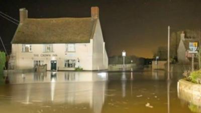 The Crown Inn surrounded by flood water