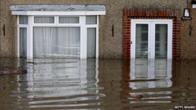 Flood water continues to surround properties in the largely evacuated village of Moorland on the Somerset Levels