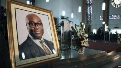 Photograph of Komla Dumor in church