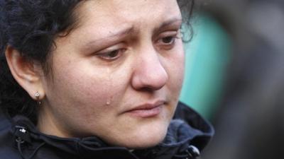 A woman cries during a funeral procession for one of the dead during violence in central Independence Square in Kiev