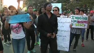 Young anti-government protesters on the streets of Caracas