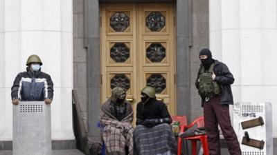 Anti-government protesters guarding the doors to the presidential offices