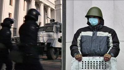 Riot police outside parliament on Friday and 'self defence' guards outside on Saturday