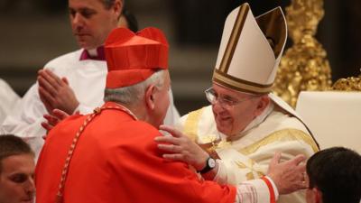 New Cardinal, Archbishop Vincent Nichols receives a hug from Pope Francis