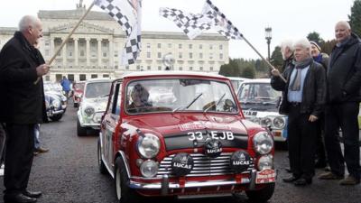 Paddy Hopkirk led a cavalcade of cars in his red Mini Cooper
