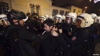 Riot police detain a demonstrator during a protest against internet censorship in Istanbul