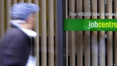 Teenager walking past job centre