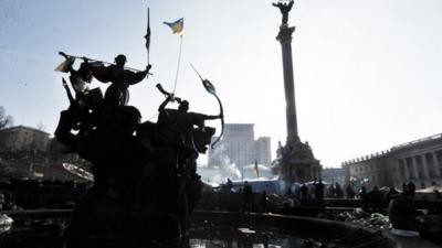 Smoke billows from stoves used by anti-government protesters camp at central Kiev Independence square