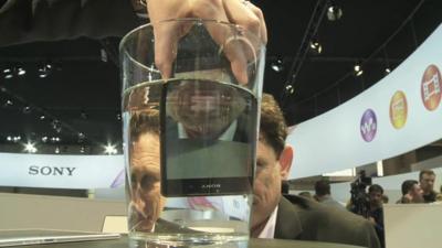 BBC Technology Correspondent Mark Gregory is shown the new Sony Xperia Z2 smartphone at the Mobile World Congress in Barcelona.