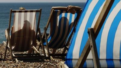 Couple sunbathing