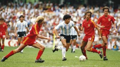 Diego Maradona scores against Belgium