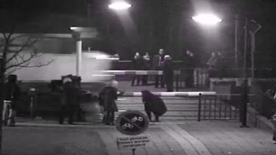 CCTV of train and pedestrians