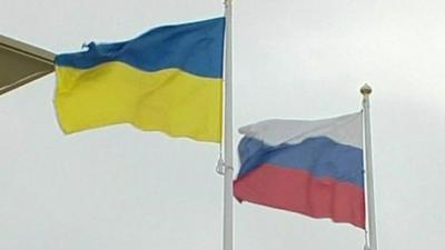 A Russian and Ukrainian flag