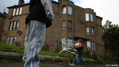 A child playing football in the Govan area of Glasgow