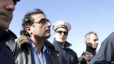 Captain Schettino in Giglio port after boarding the wreck of the Costa Concordia