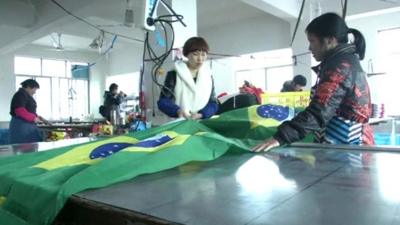 Factory workers making a Brazilian flag