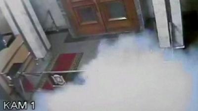 Still from CCTV footage shows smoke rising after an explosion inside Crimea's Regional Parliament Building