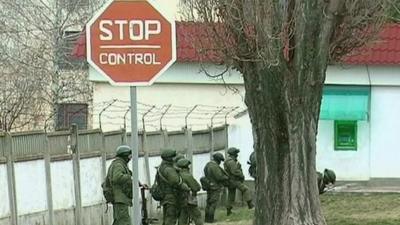 Military near stop sign