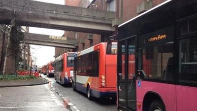 Buses queue up near the bus station