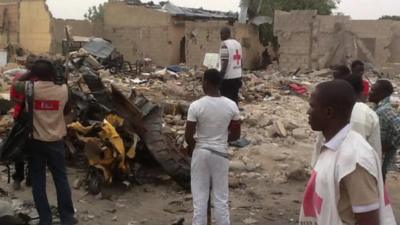 Red Cross workers survey damage