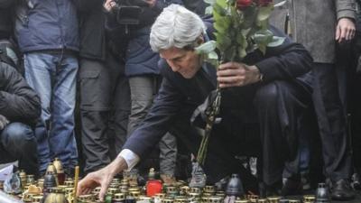 John Kerry lights a candle