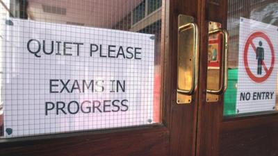 Exam sign on door