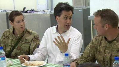 Ed Miliband with two soldiers