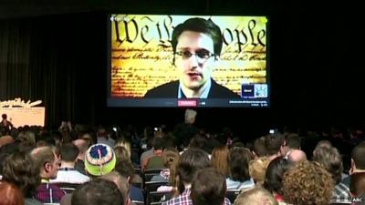 Edward Snowden speaking to technology innovators via video link at SXSW